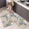 A rectangular patterned floor mat with blue, orange, and cream designs placed on a light wood floor.