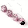 Ein Set rosa Kristall-Diamant-Radventilkappen auf weißem Hintergrund
