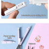 A white pen-shaped tool is shown with a detachable paper cutting blade and scissors for crafting.