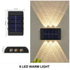 A solar powered wall light featuring six LED warm lights providing upward and downward illumination.