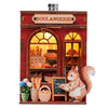 A miniature brick bakery display featuring bread and a fox figurine, part of a DIY book nook kit.