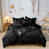 Black gamer-themed duvet cover set featuring a controller and keyboard print displayed on a bed.