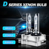 A pair of D Series Xenon bulbs displayed in their holders against a dark car background.