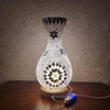 A handcrafted Turkish mosaic table lamp with a warm LED glow sits on a wooden surface.