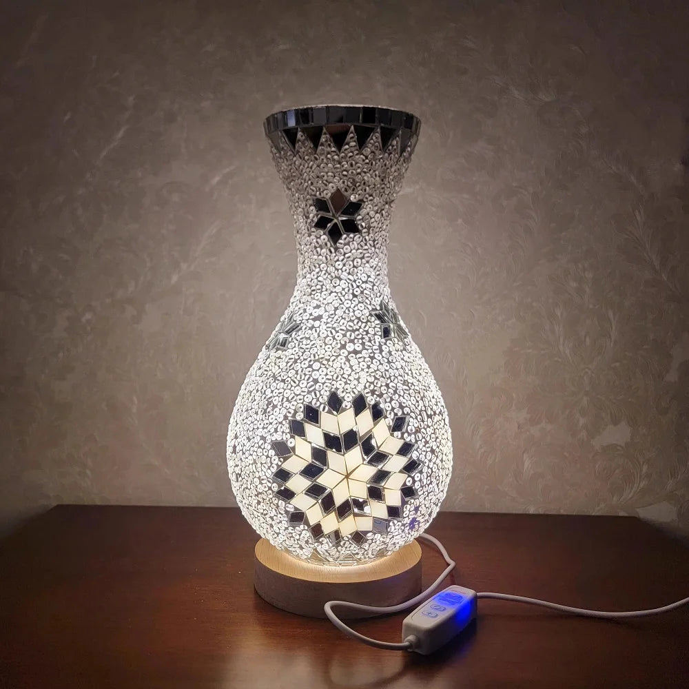 A handcrafted Turkish mosaic table lamp with a warm LED glow sits on a wooden surface.