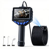 A black industrial borescope device with a screen and probe, next to various endoscope tips.