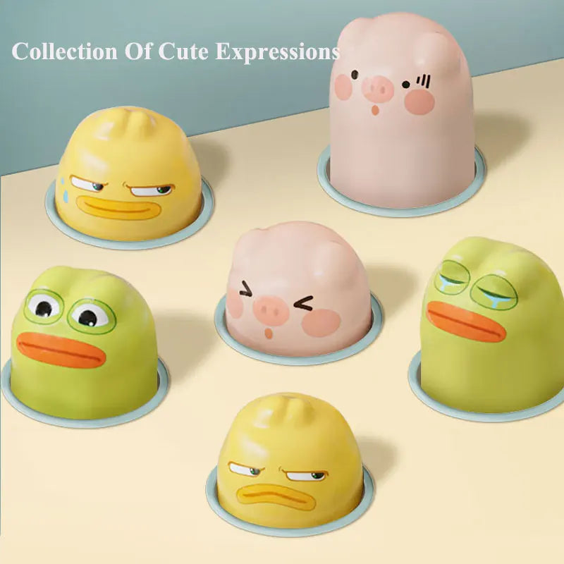 A collection of cute expressions toys shaped like a pig, duck, and frog in various colors.