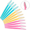 A set of pink and blue precision eyebrow razors for facial grooming and dermaplaning.