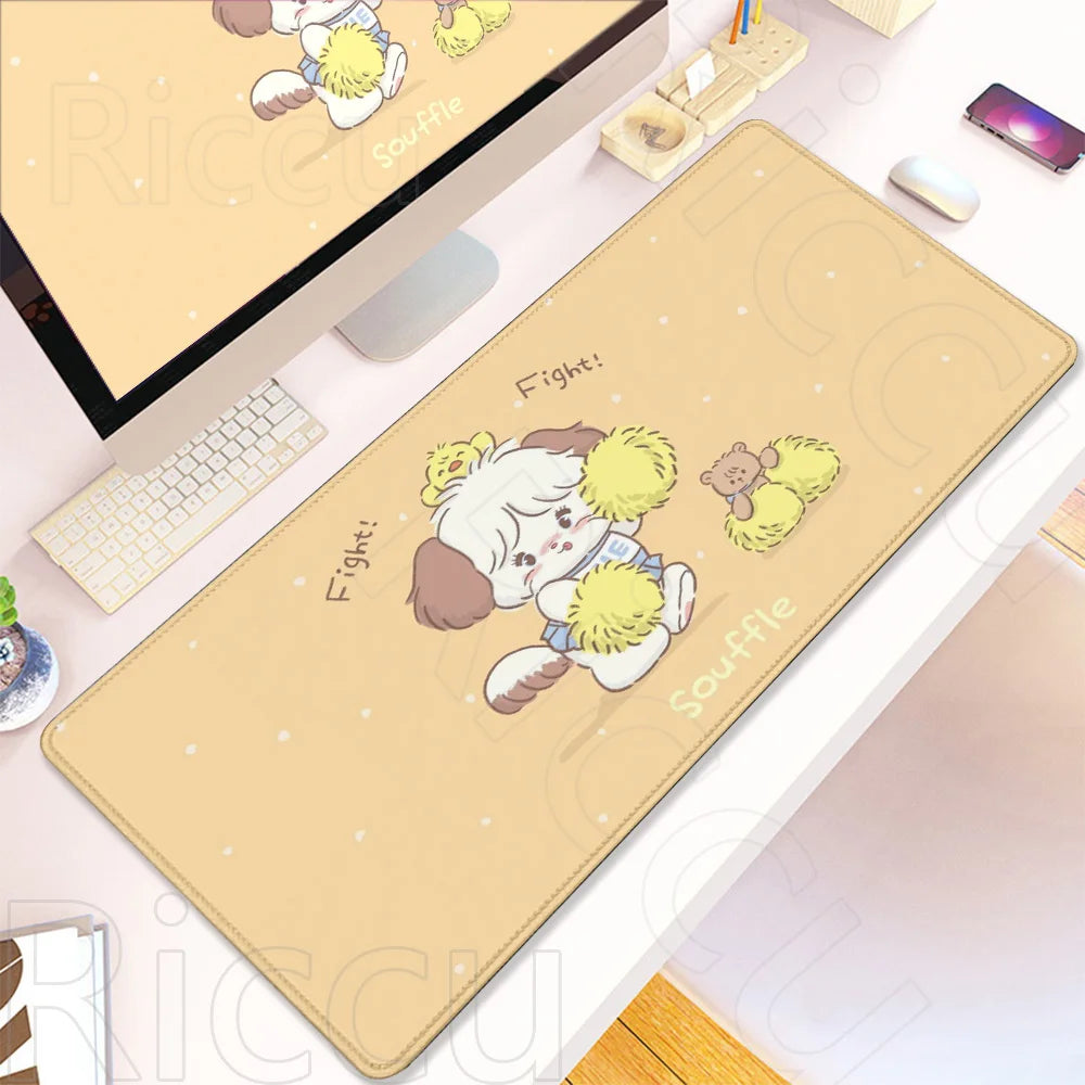 A beige kawaii cartoon gaming desk mat featuring a fluffy white animal character and text on a white desk surface.