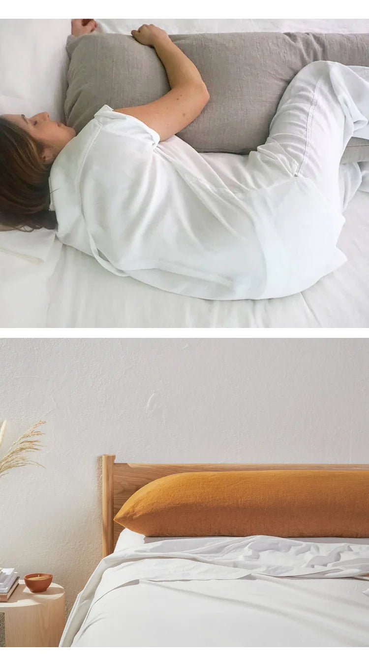 A white linen pillowcase is shown being used in a bedroom setting.