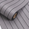 Roll of gray 3D grille pattern peel-and-stick wallpaper showing vertical lines.