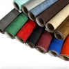 Rolls of self-adhesive suede fabric in various colors like green, red, blue, and brown for DIY projects