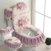A set of antibacterial toilet seat covers featuring pink and white floral lace designs on a purple fabric cushion.