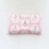 Pink soft cotton baby pillowcase featuring a repeating pattern of cartoon dresses.