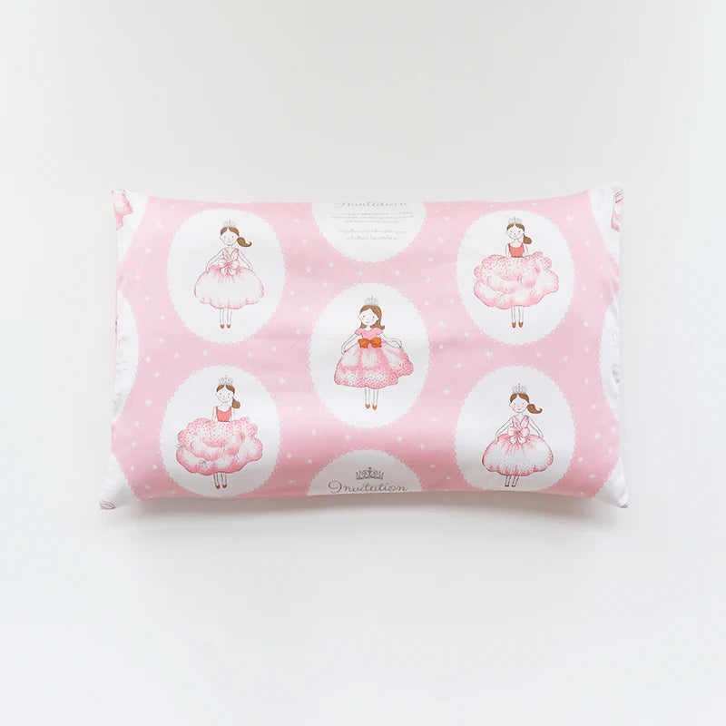 Pink soft cotton baby pillowcase featuring a repeating pattern of cartoon dresses.