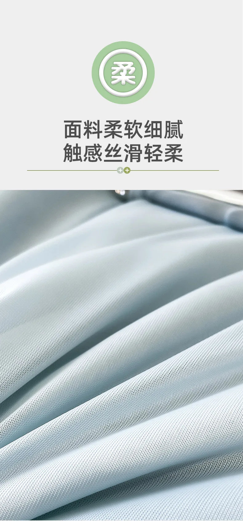 Close-up of a light blue, textured fabric blanket being draped or folded.
