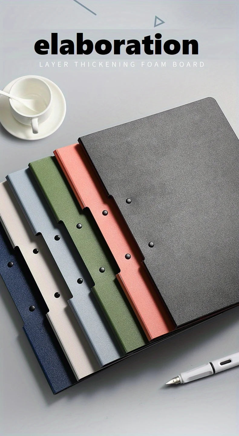 A stack of layered foam boards in various colors, including gray, pink, green, and blue, shown on a light surface.