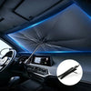 Interior view of a car showing a foldable windshield sun shade umbrella with blue ambient lighting.