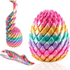 A vibrant pink and multicolored twisty fidget egg stress relief toy shown in various forms.
