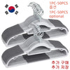 A set of white plastic anti-slip hangers with rotating hooks and gray anti-slip pads.