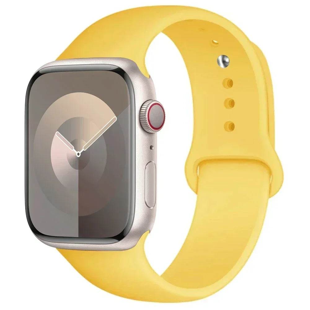 A yellow silicone sport band is shown alongside an Apple Watch, highlighting the watch and strap.