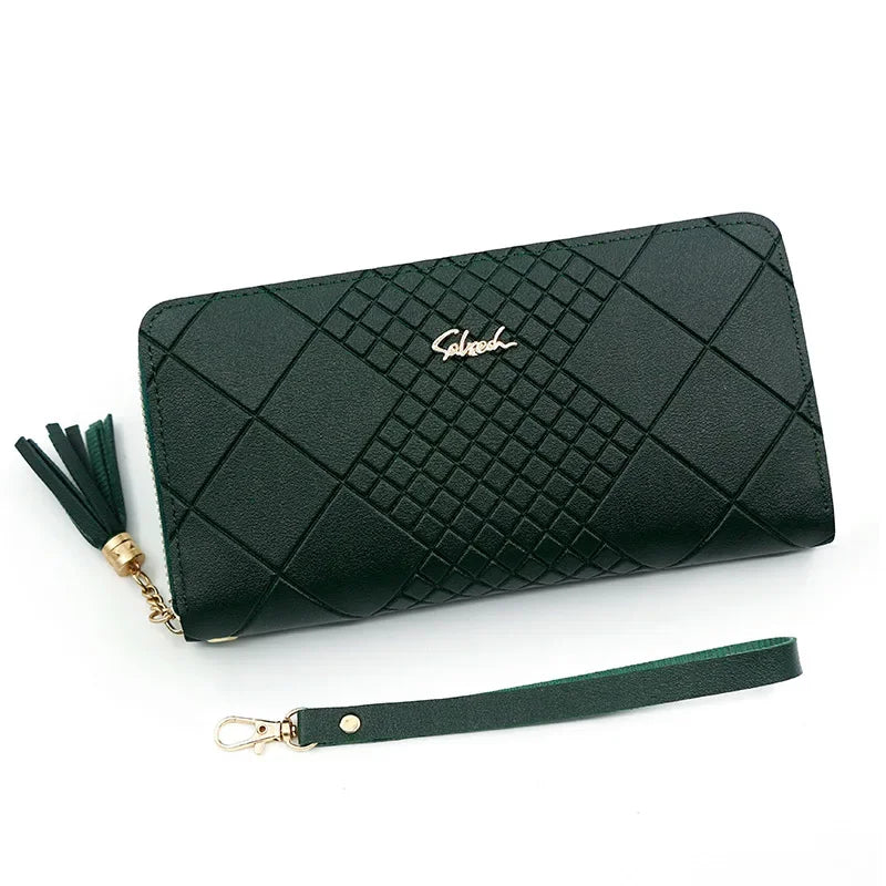 A dark green quilted PU leather wristlet clutch wallet with a gold chain detail and a matching strap.