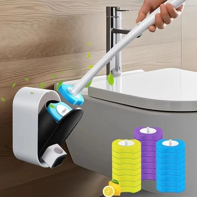 A hand is using a white handle to operate a disposable toilet brush refill with a built-in cleaning solution.