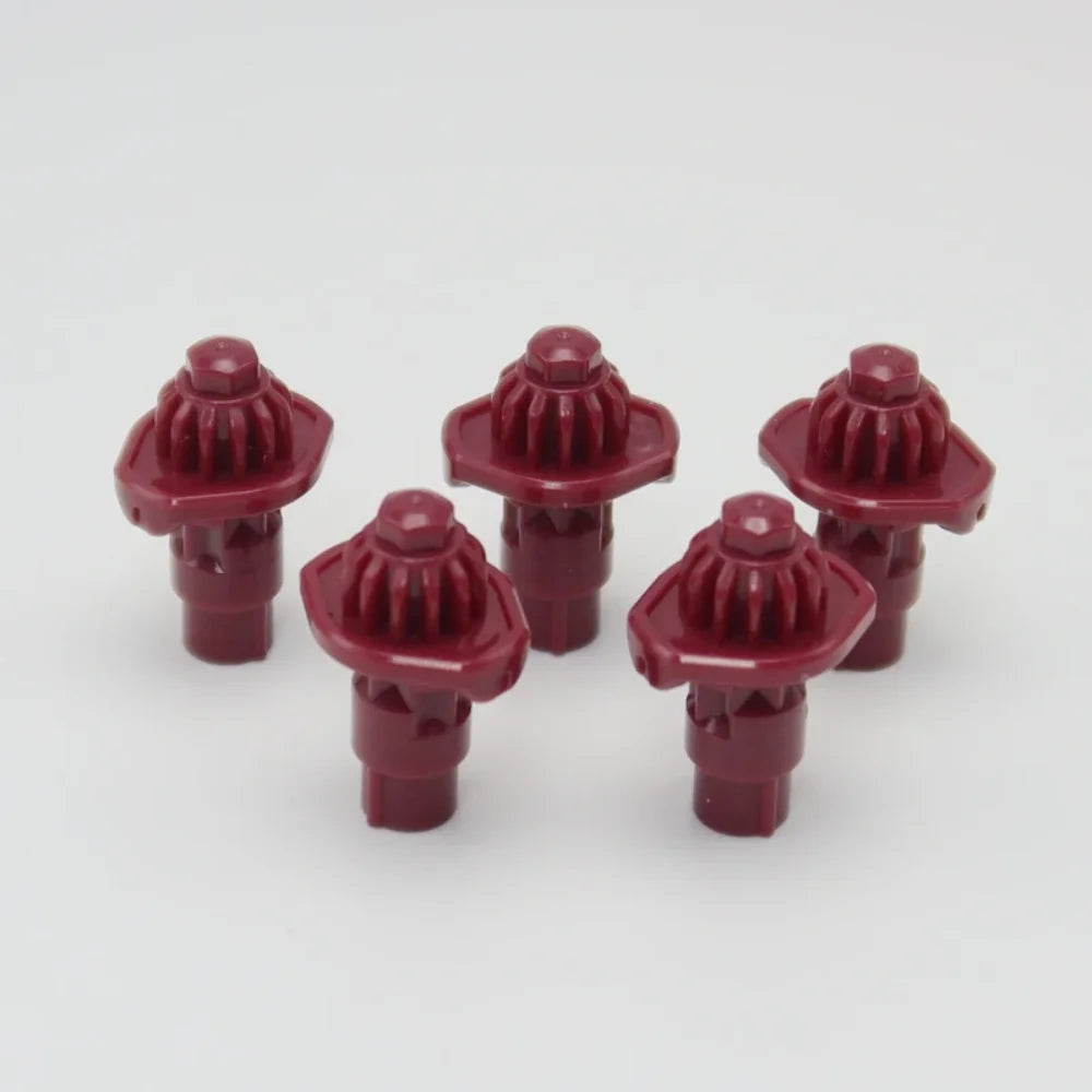 A set of five red replacement drivers for a Battling Top, used to fix or replace the top mechanism.