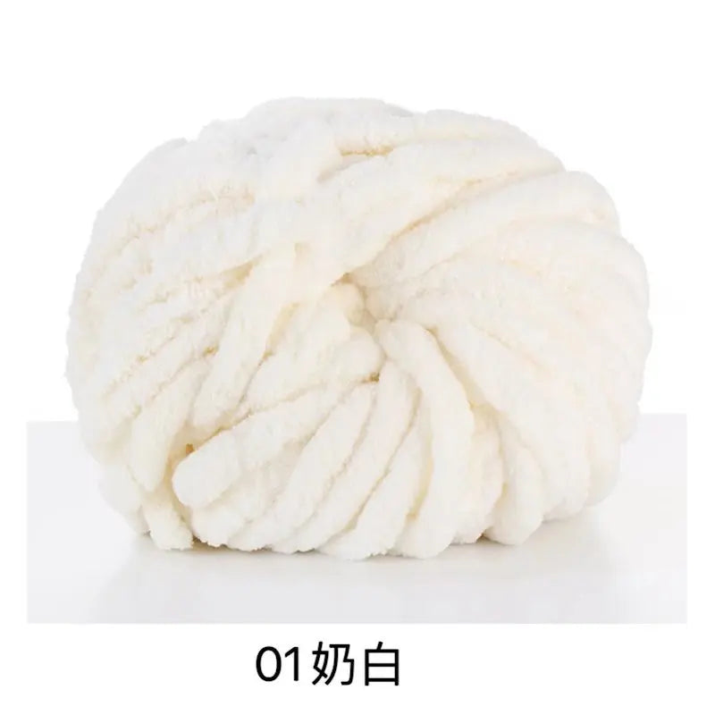 A ball of white chunky acrylic yarn for knitting and crochet