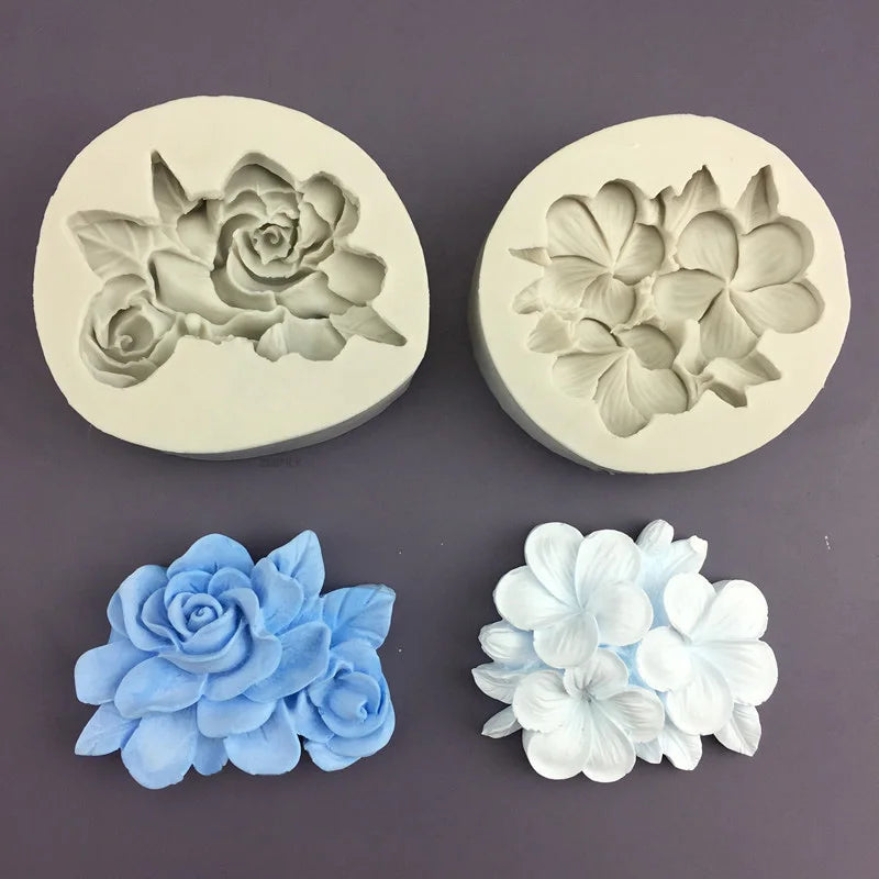 Two silicone molds showing floral designs in gray and white tones for baking and crafting
