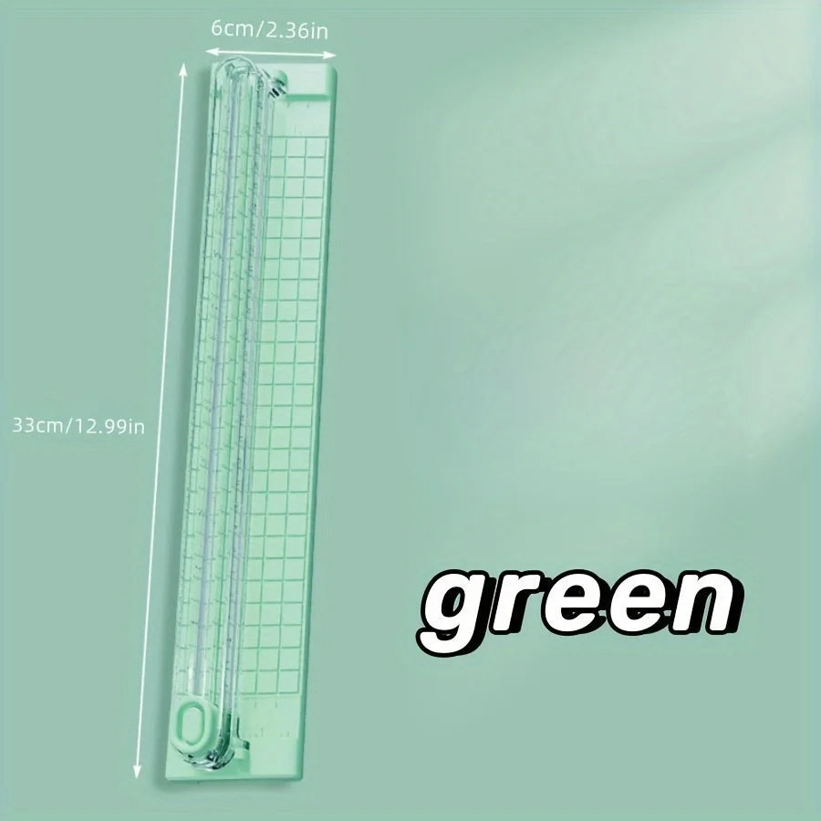 A green portable paper cutter trimmer with a 33cm length and 6cm width.