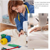 A woman is shown using a T-shape design pin for sewing or crafting on a piece of fabric.