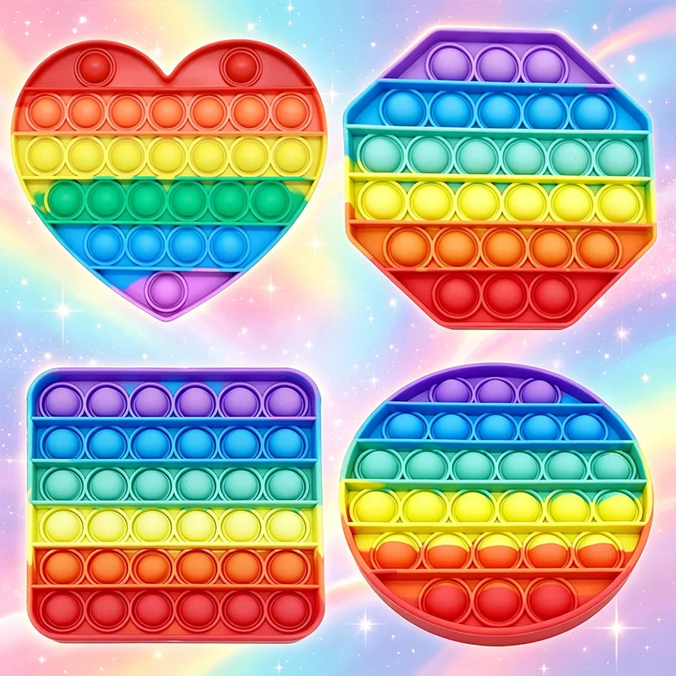 A collection of colorful rainbow pop bubble fidget toys in various shapes and sizes.