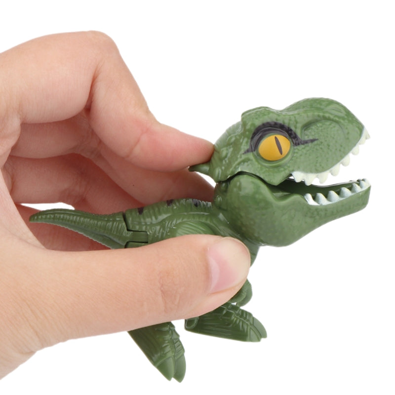 A hand is holding a green plastic dinosaur toy, resembling a Triceratops or Tyrannosaurus, with an open mouth showing teeth a