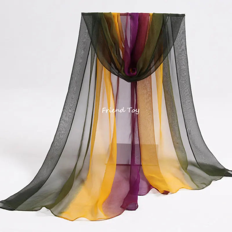 A sheer fabric drape featuring vertical stripes of green, yellow, and purple tones for imaginative play.