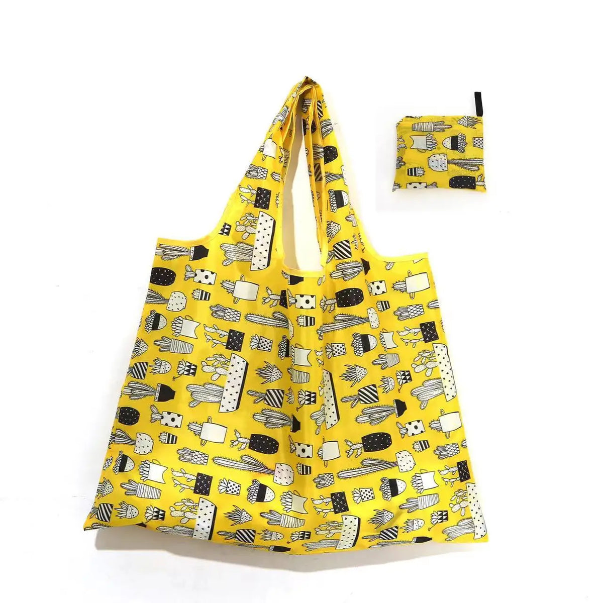 A yellow reusable shopping tote bag with a patterned fabric carry pouch attached.