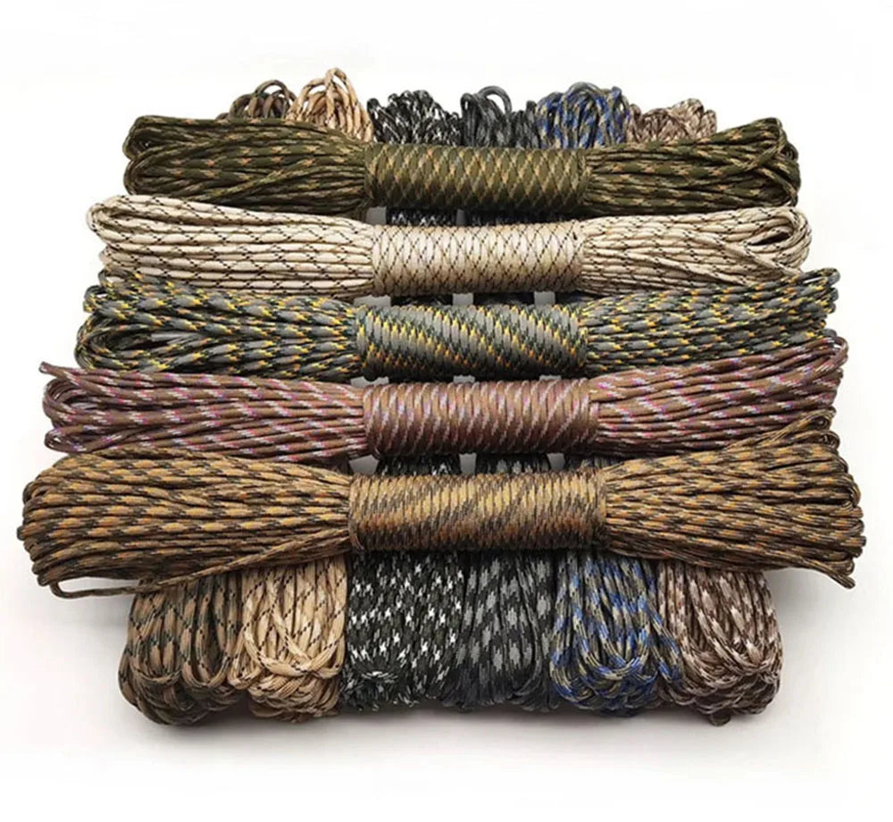 A stack of ten 100-foot paracord ropes in various colors and thicknesses for camping and climbing.