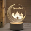 A glowing Ramadan crescent moon silhouette featuring a mosque design on a clear acrylic night light.