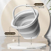 A white foldable portable wash basin with a comfort handle is shown pouring water precisely onto a surface.
