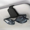 Black magnetic leather sunglasses holder designed to secure eyewear in car sun visors.