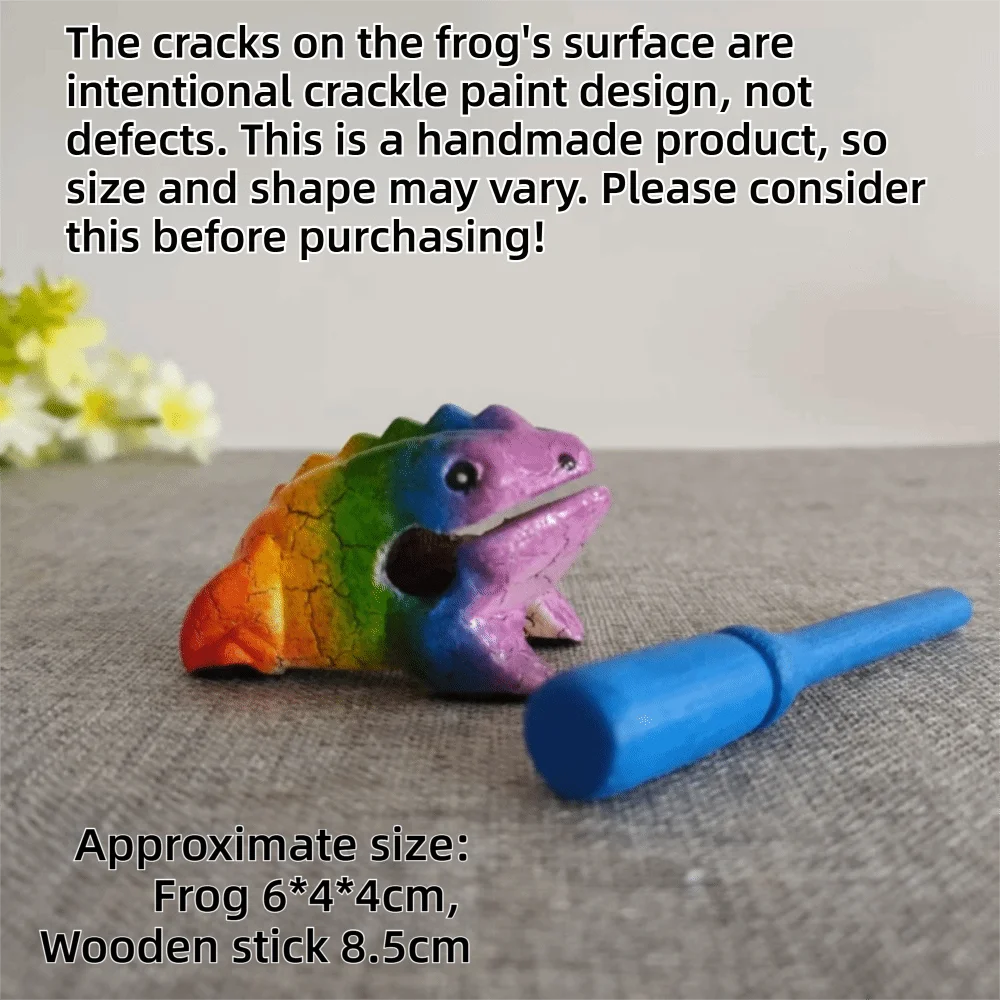 A handcrafted wooden frog percussion instrument with colorful crackle paint on a gray surface.