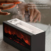 A black ultrasonic aroma diffuser with a glowing fireplace effect is shown next to a hand adding essential oil drops.