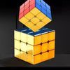 A magnetic speed cube with a mirror finish, featuring three stacked cubes in red, blue, and yellow.