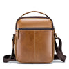 A brown men's genuine leather crossbody shoulder bag with a top handle and adjustable strap.