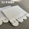 24 pairs of white removable adhesive picture hanging strips shown on a gray surface.
