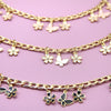Gold chain necklace with small flower charms and pearl accents