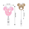 A pink Mickey Mouse-themed badge reel featuring a nurse design and gold glitter accents.