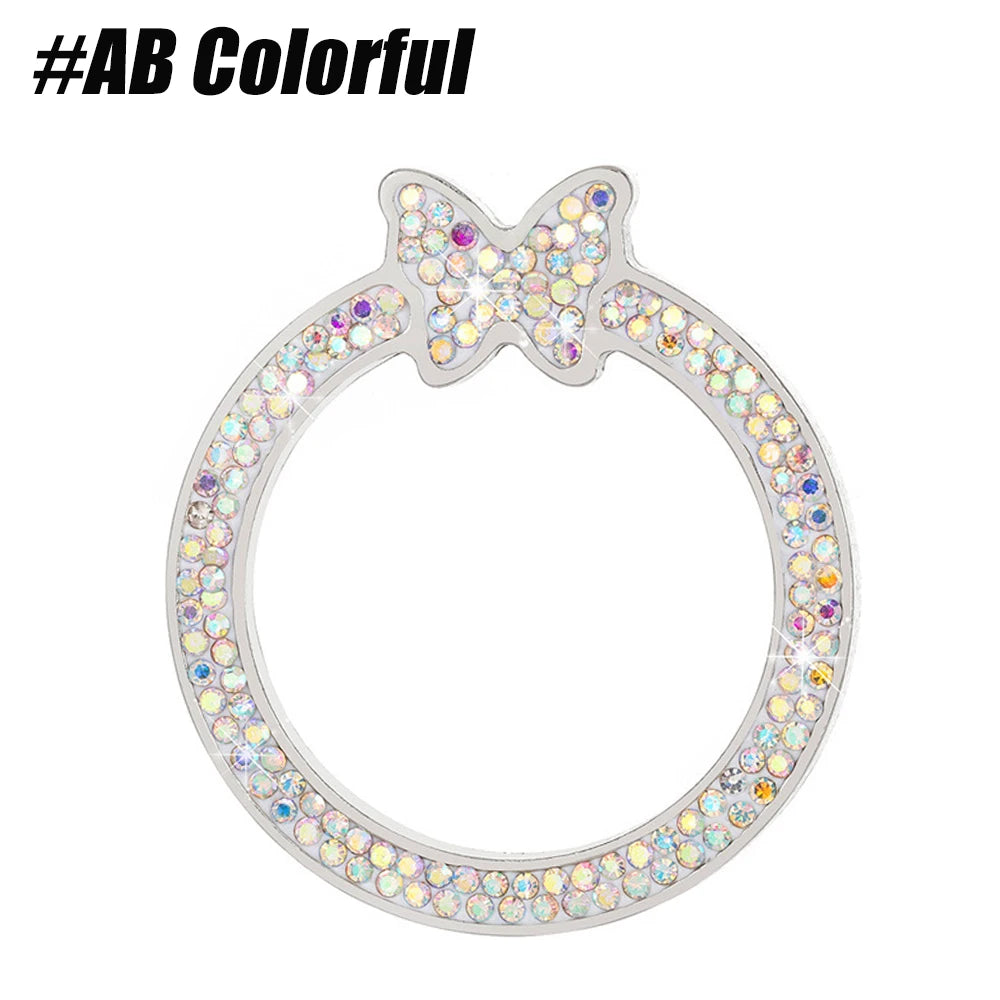 Silver crystal rhinestone ring with a butterfly design set against a white background.