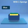 Blue kitchen soap dispenser with a yellow and green sponge inside