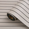Roll of 3D grille pattern peel-and-stick wallpaper with black horizontal stripes on a light background